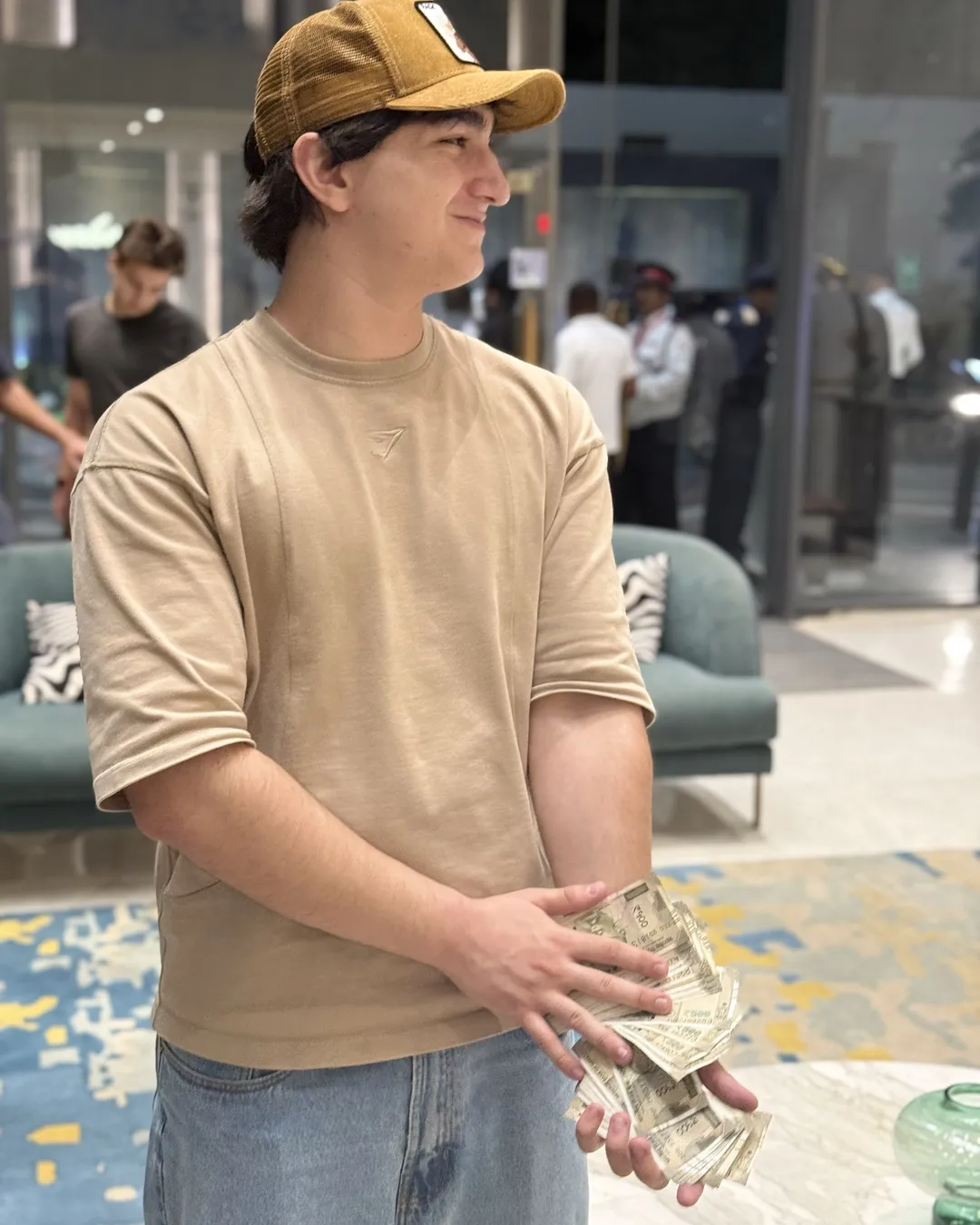 One of the team holding the cash from a sale